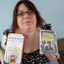 Jodi Wilkinson holding Adrian Mole book and DVD