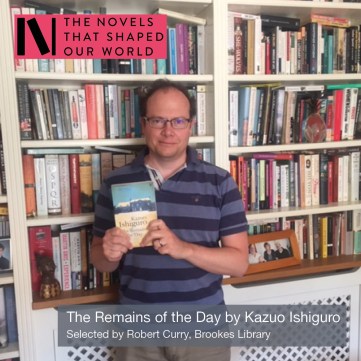 Robert Curry from Oxford Brookes library holding a copy of The Remains of the Day by Kazuo Ishiguro