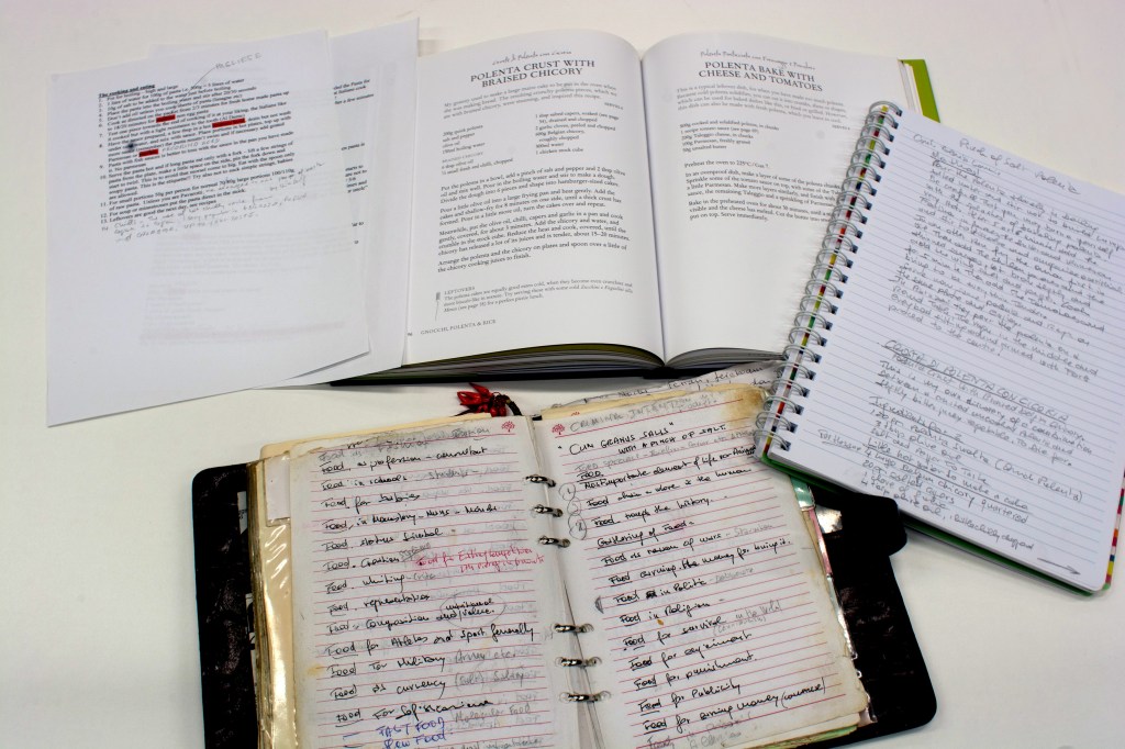 The published book 'Simple cooking' with handwritten notebooks alongside